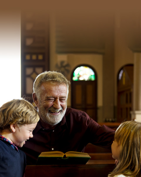 Priest smiling in church