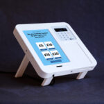 White enclosure with donation options on screen and SumUp